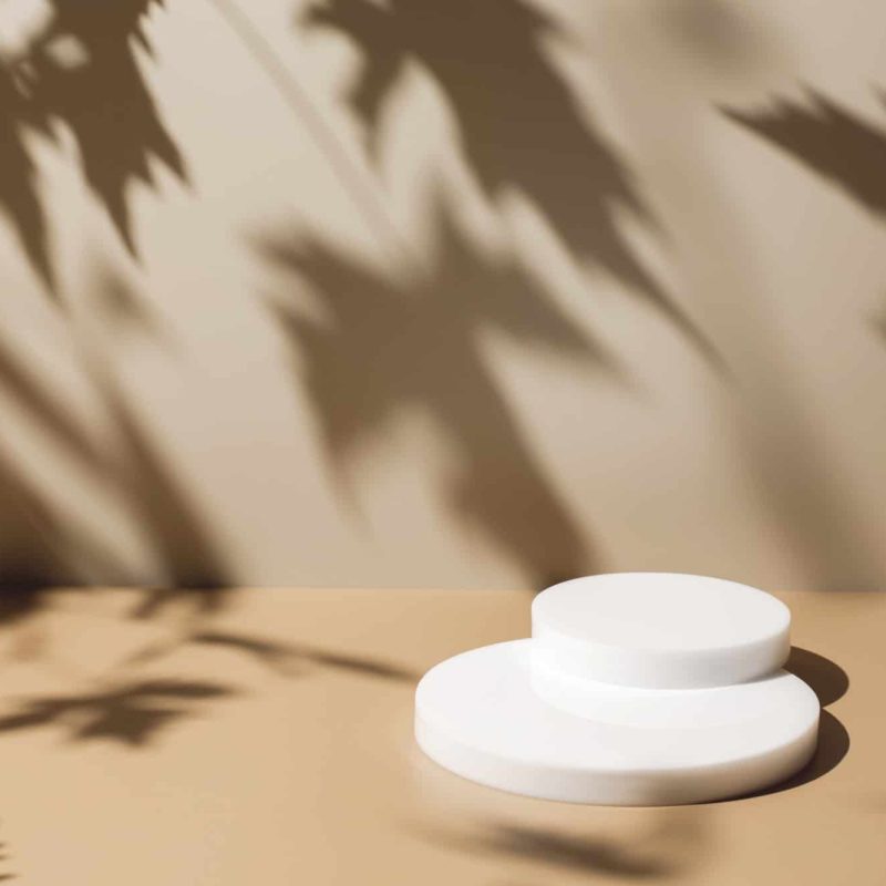 abstract-minimal-nature-scene-with-white-podium-on-beige-background-and-leaves-shadows.jpg